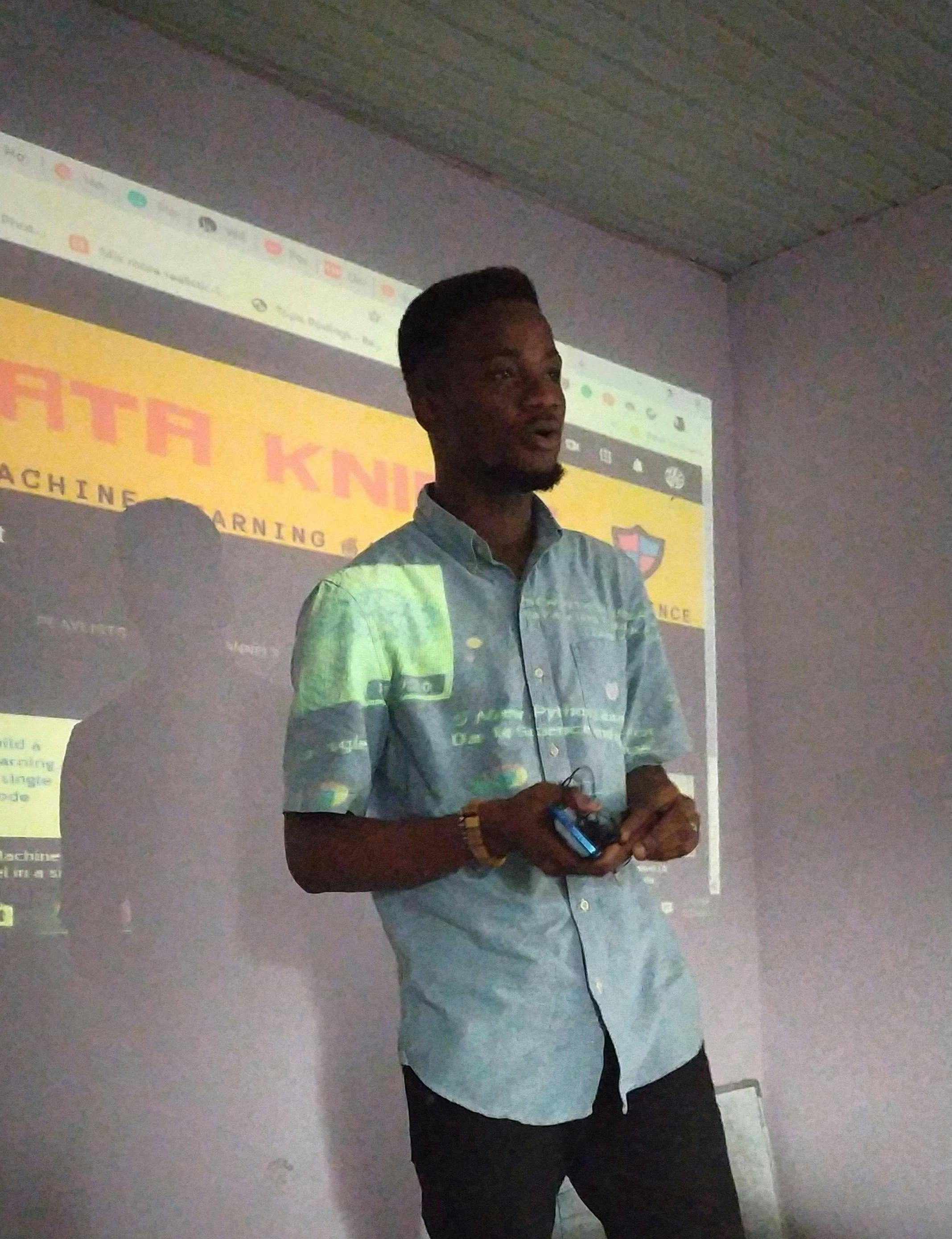 Emeka Boris (Data Knight) stands in front of the class to share with participants his career journey so far.