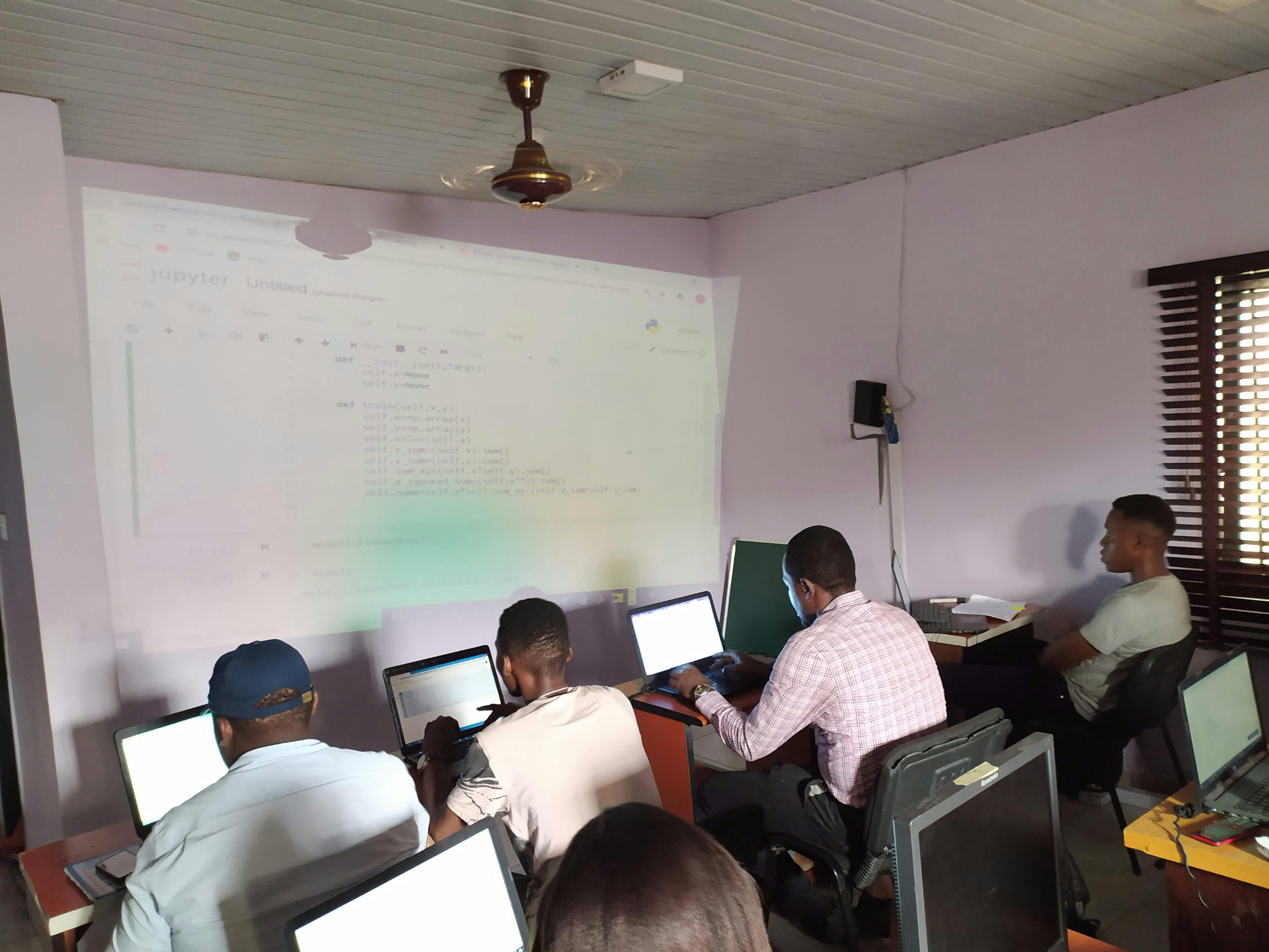 Students writing code on their computers