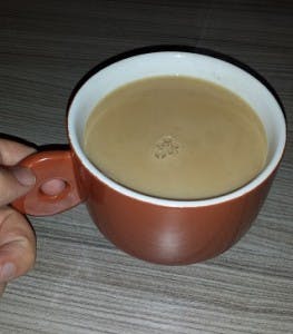 Holding-mug-263x300.jpg