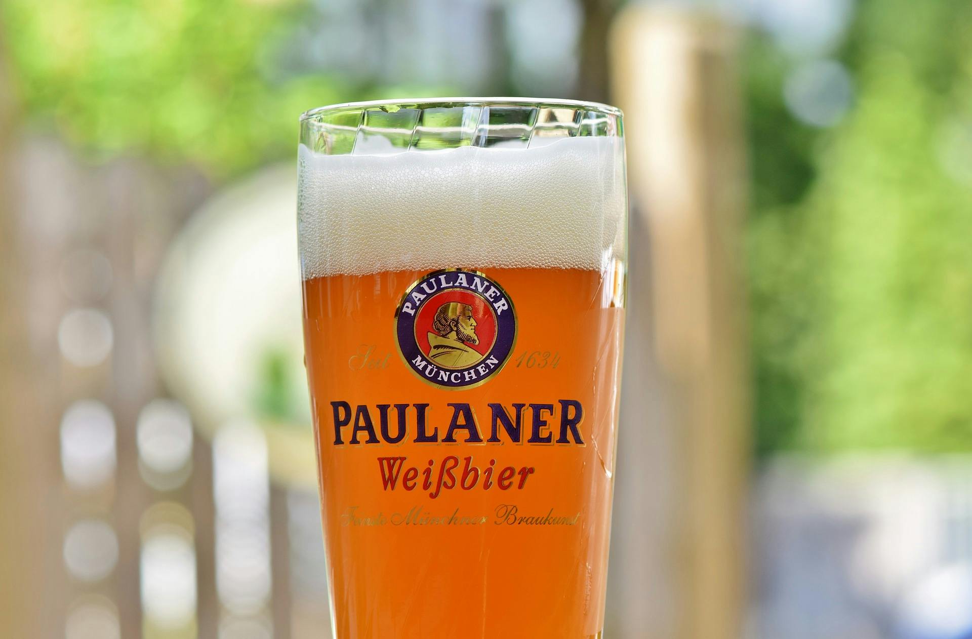 photo of paulaner wheat beer in a glass with the logo