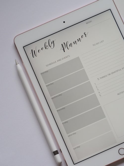 an iPad showing a weekly planner