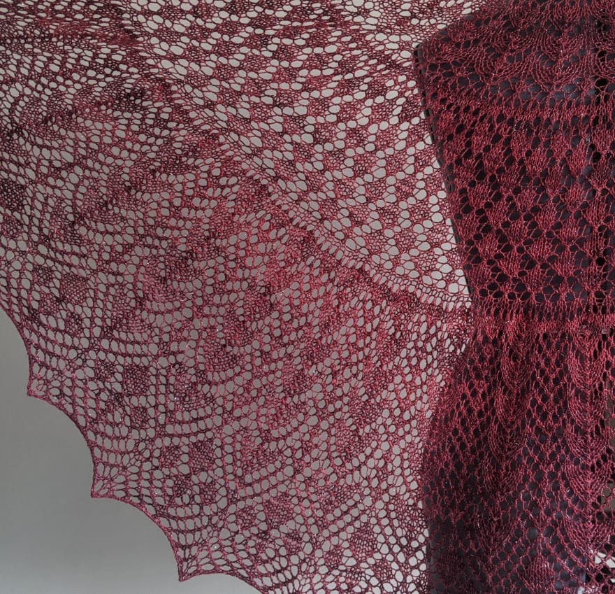 lacy Dowland shawl knit in sparkly burgundy yarn