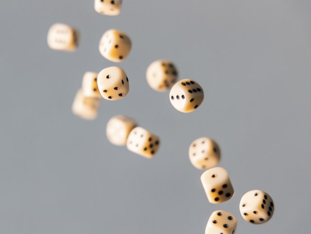 A group of dices flying through the air.