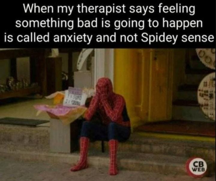 Sad spider-man sitting on a curb, holding his head in his hands. The caption says: When my therapist says feeling something bad is going to happen is called anxiety and not spidey-sense