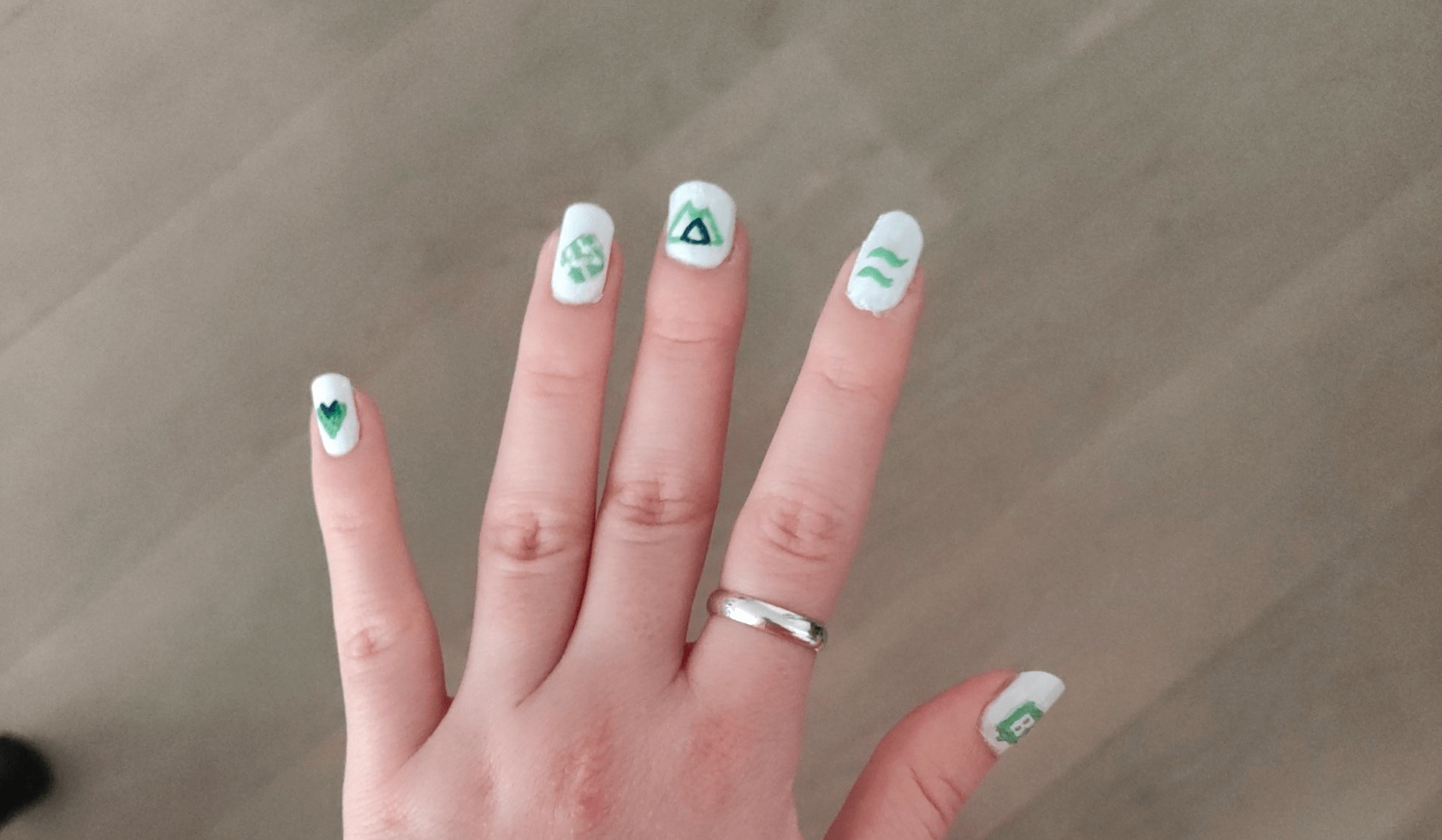 Real painted Jamstack nails including Netlify, Nuxt, Storyblok, Vue and TailwindCSS logos