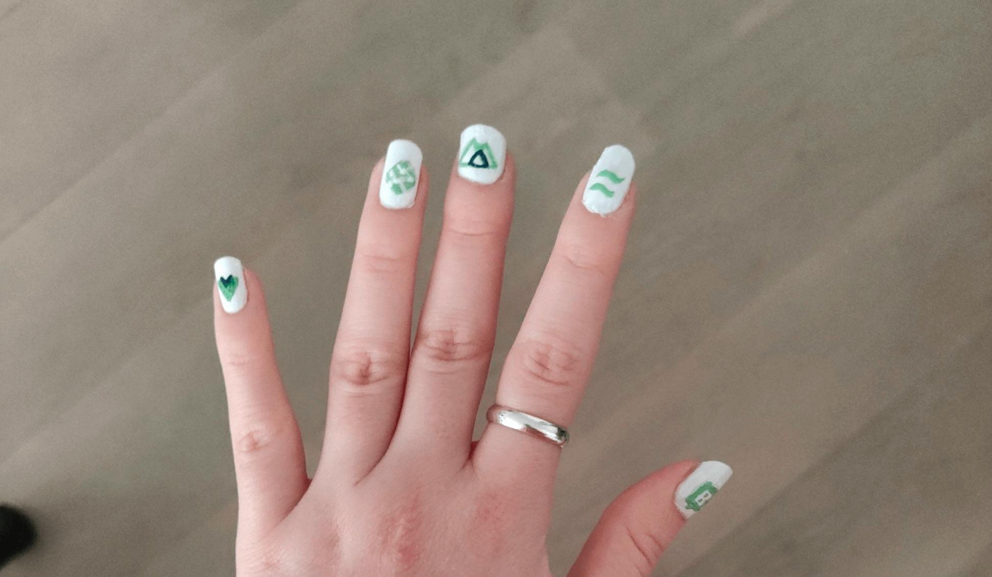 Real painted Jamstack nails including Netlify, Nuxt, Storyblok, Vue and TailwindCSS logos