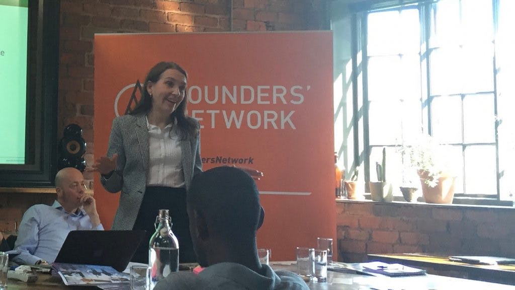 Louise Handley stood in-front of the 'Founders Network' sign
