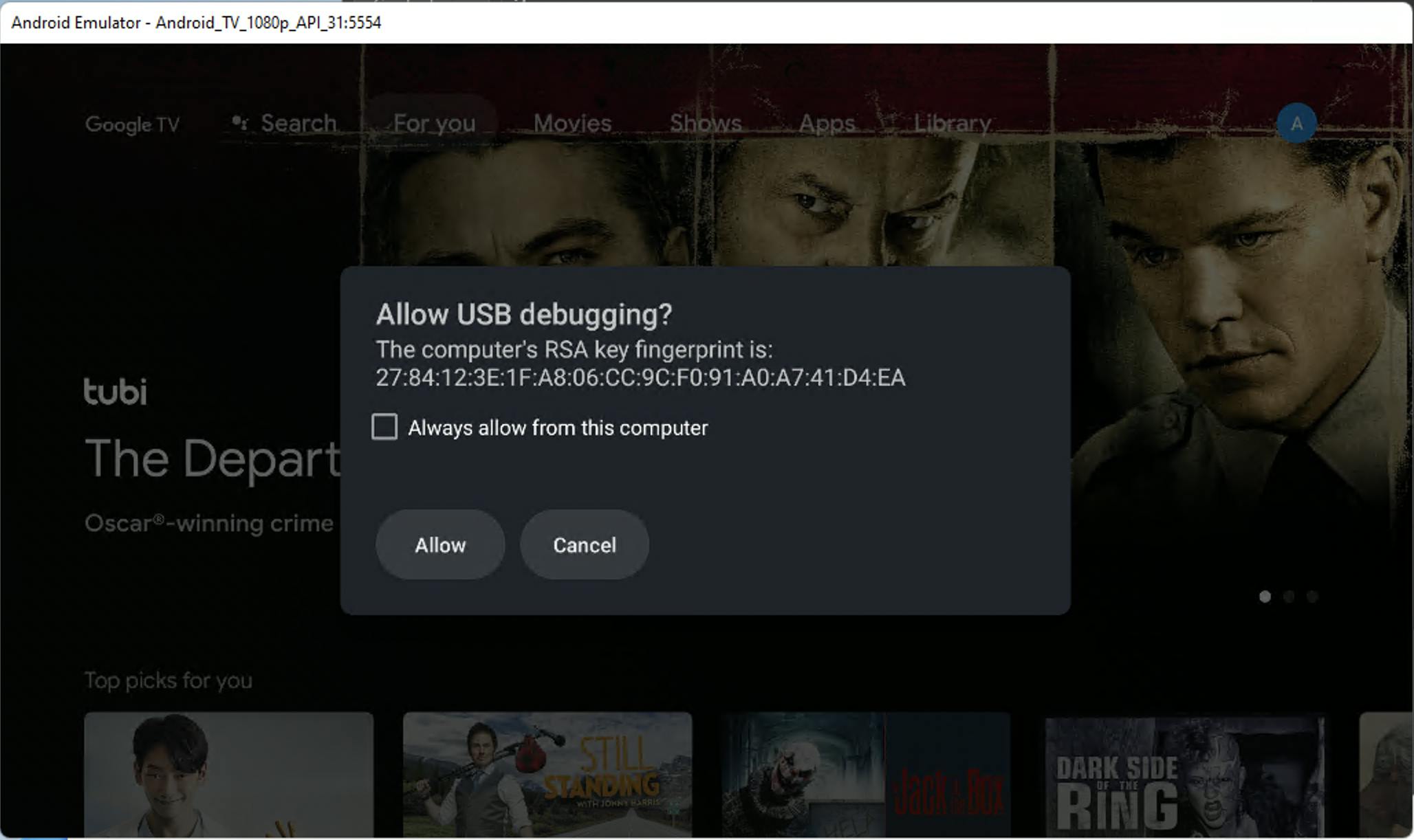 Android TV emulator showing a debug authorization dialog