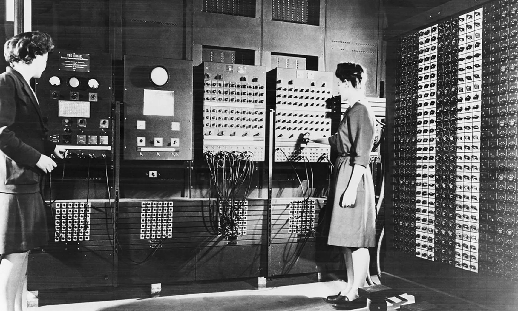Betty Jean Jennings (left) and Frances Bilas operating ENIAC's main control panel.