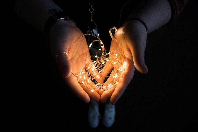 string light on hands