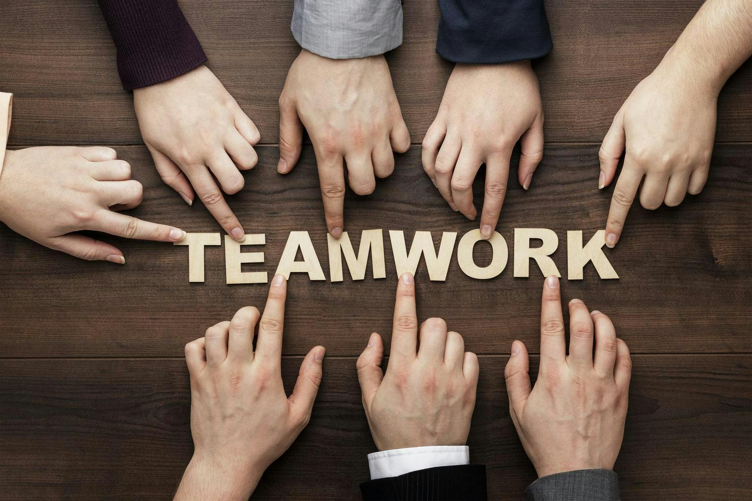 teamwork-concept-on-the-brown-wooden-table-background.jpg