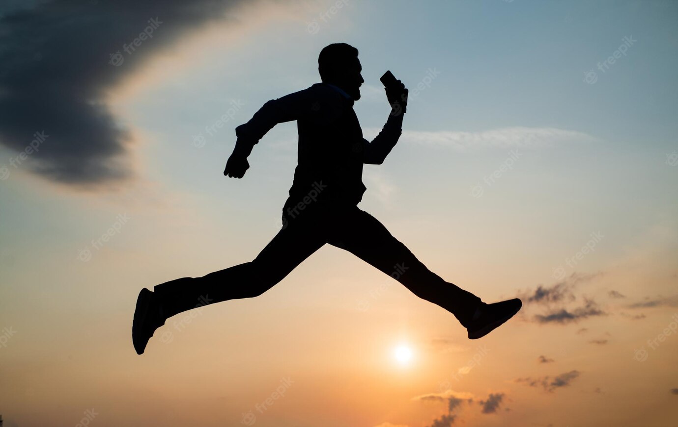 total-freedom-personal-achievement-goal-man-silhouette-jump-sky-background-confident-businessman-running-daily-motivation-enjoying-life-nature-business-success-freedom_474717-27597.jpg