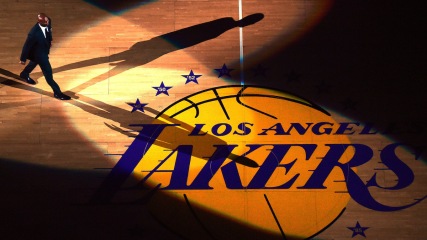 LOS ANGELES, CA - DECEMBER 18: Kobe Bryant walk out to center court during his jersey retirement ceremony at halftime of a basketball game between the Los Angeles Lakers and the Golden State Warriors at Staples Center on December 18, 2017 in Los Angeles, California. (Photo by Harry How/Getty Images)