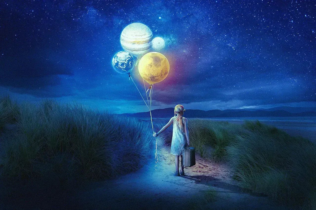 A picture of a girl holding balloons that look like planets