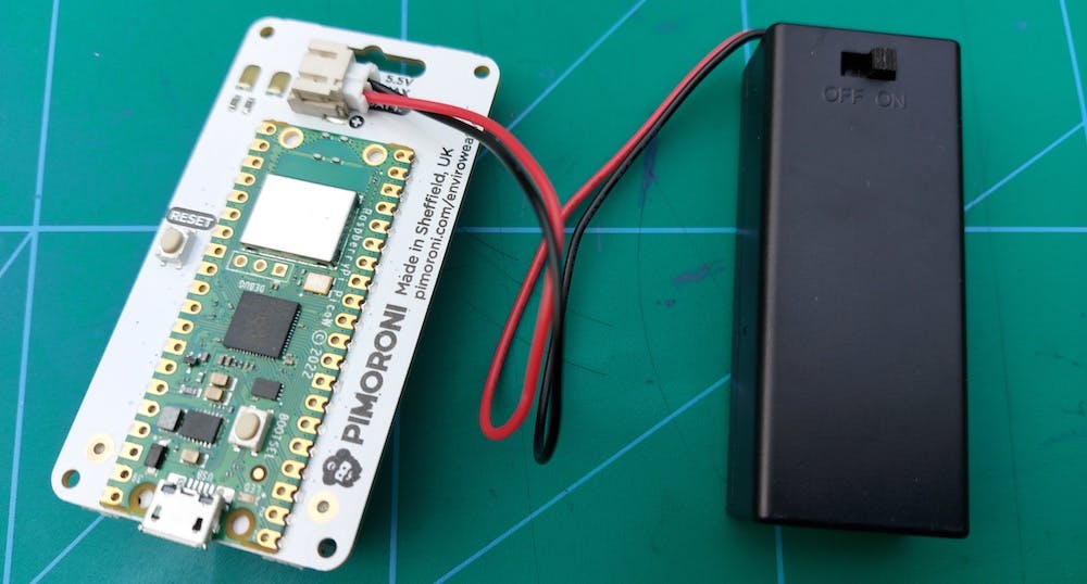Photo showing the Pimoroni Enviro Weather board with the AAA battery pack that will hopefully power it for months!
