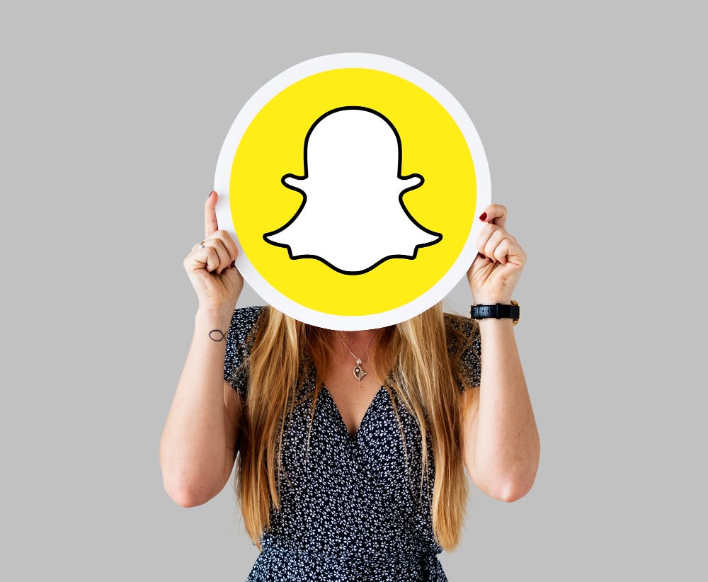 woman-showing-snapchat-icon.jpg