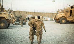 FILE PHOTO: A U.S. soldier from the 3rd Cavalry Regiment walks with the unit's Afghan interpreter before a mission near forward operating base Gamberi in the Laghman province of Afghanistan December 11, 2014. REUTERS/Lucas Jackson/File Photo