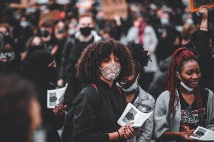 Featured Women Holding Black Power Fist Papers