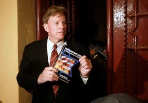 FILE PHOTO -- David Duke, former Republican member of the Louisiana House of Representatives and former Grand Wizard of the Knights of the Ku Klux Klan, speaks to journalists on a street in central Barcelona, November 24, 2007, after the suspension of an initially planned news conference on the Spanish version of his book "Jewish Supremacy" (Supremacismo Judio). REUTERS/Gustau Nacarino/File Photo - RTSJ8CH