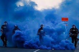 Smoke Bomb Cops In Riot Gear