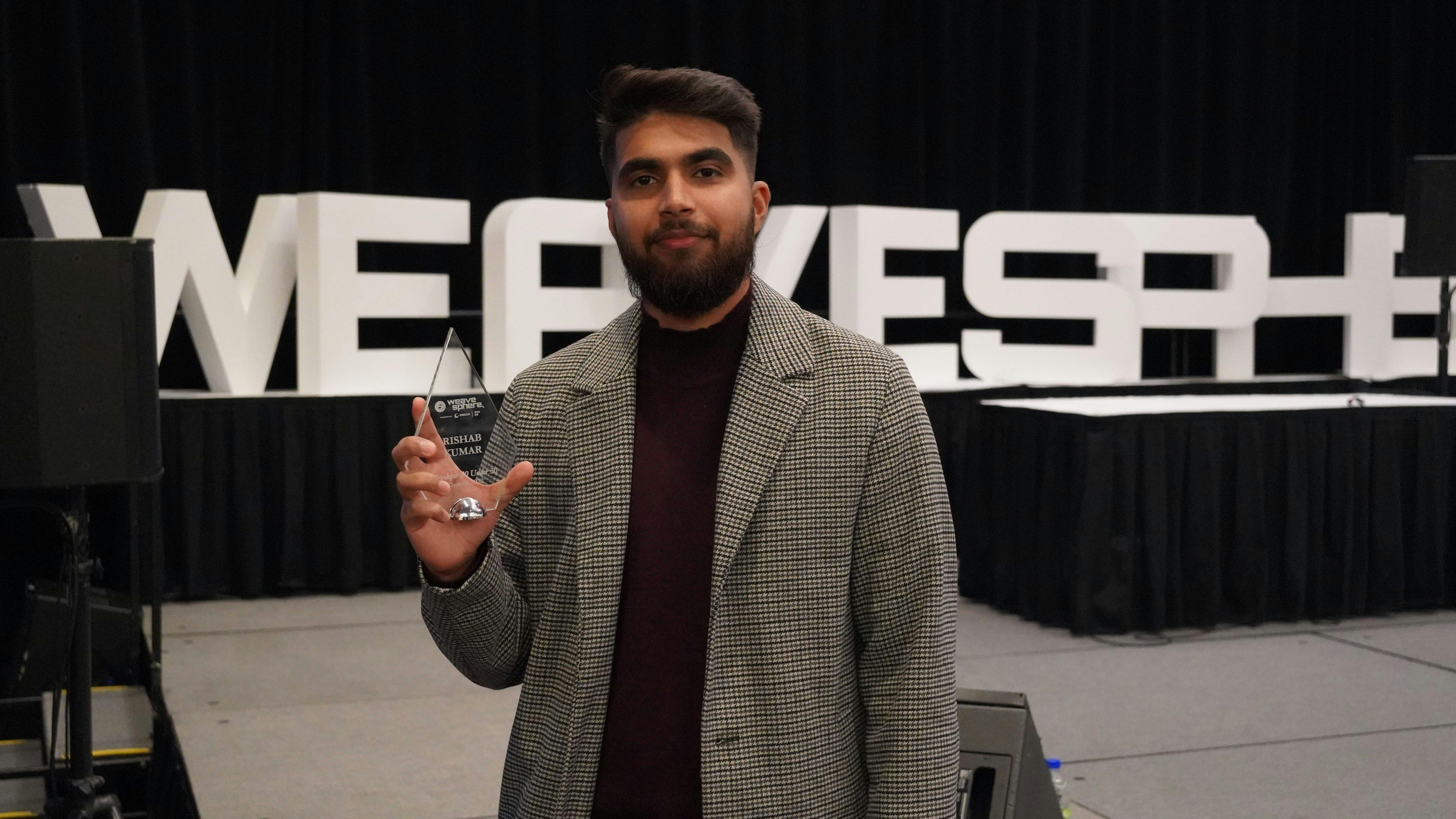 Me holding the Canada Developer 30 Under 30 award