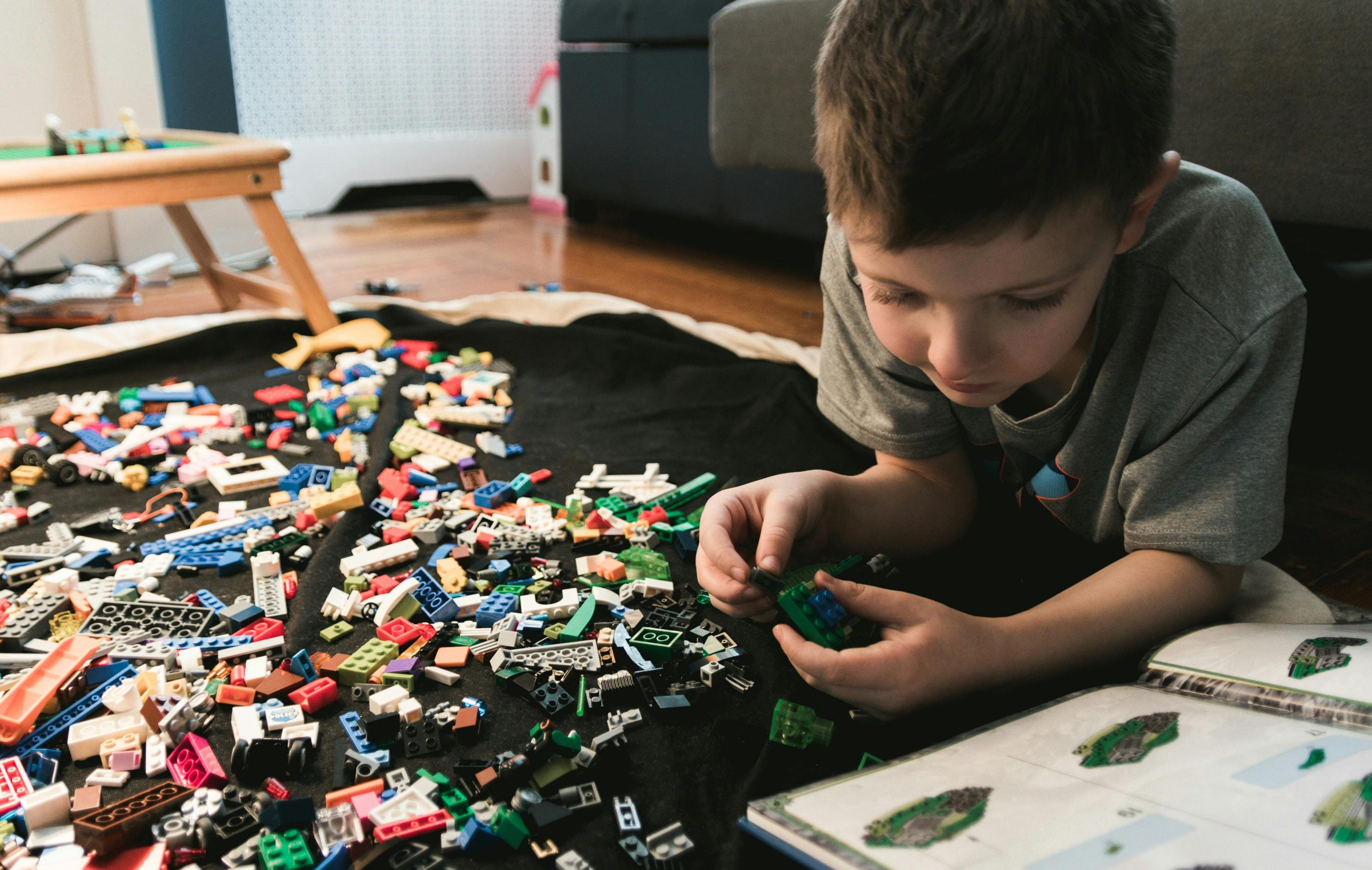 Child building lego