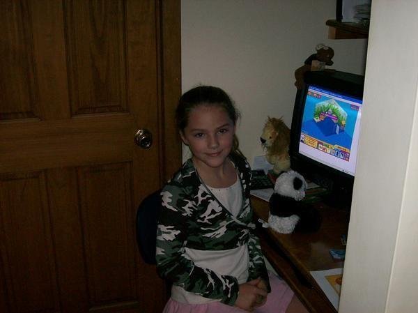 Me, six or seven years old, Playing Webkinz  on a computer at my grandma's house (you literally could not get me away from the computer if you tried)