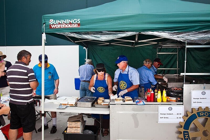 People at a sausage sizzle outside Bunnings