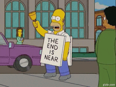 Homer with a sign written "The end is near"