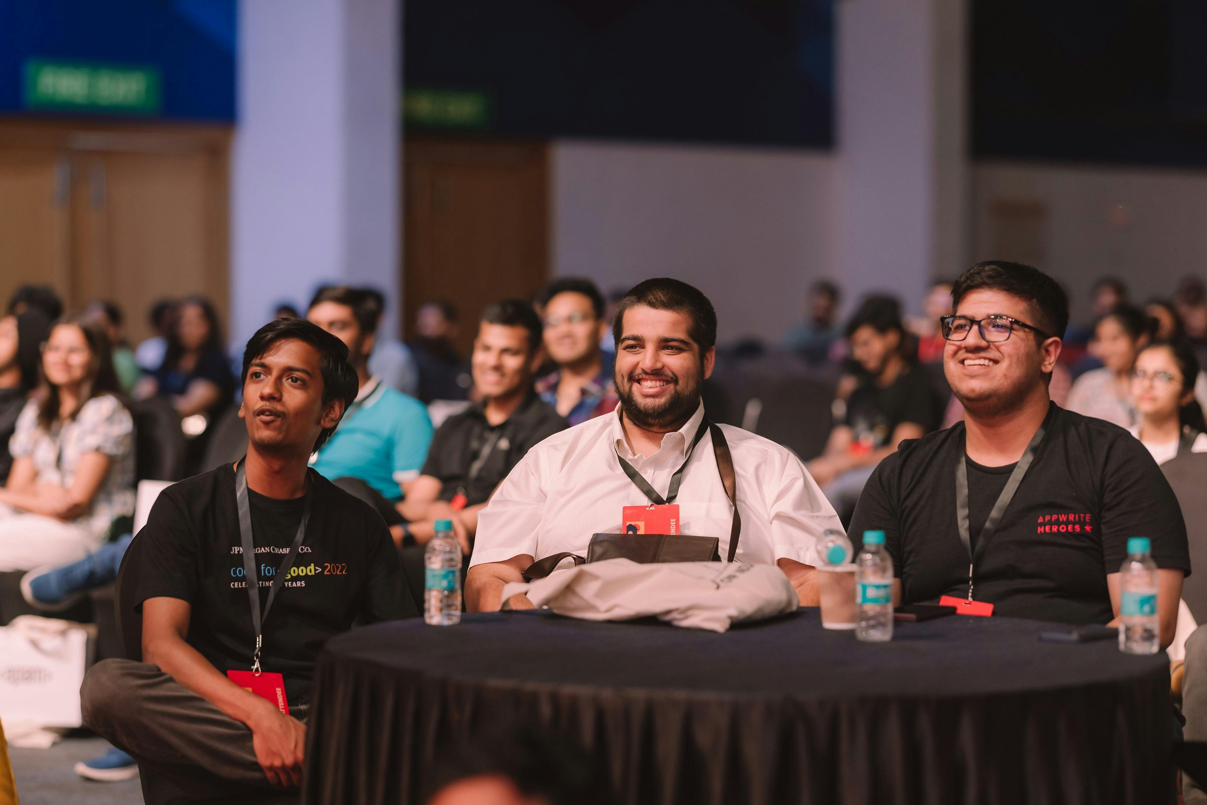 A photo of myself (left), Dheeraj Lalwani (center) and Aditya Oberai (right) captured by Team PreMagic in JSConf Bengaluru, 2023.