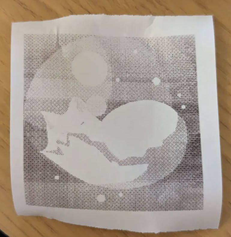 A printout of the Dreamcat logo -- a snoozy cat.