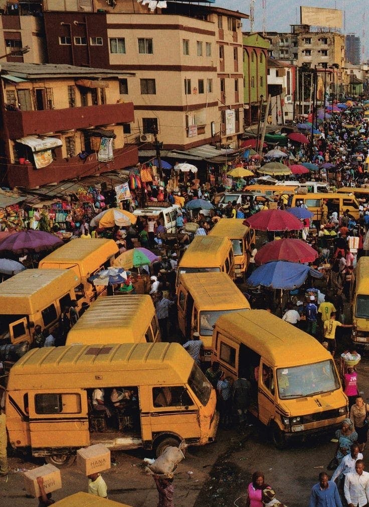 Yellow Danfos, busy people. A typical day in Lagos as found on Pinterest.