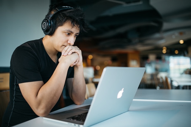 one man staring at computer screen