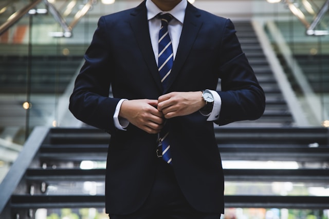 man in blue suit and tie