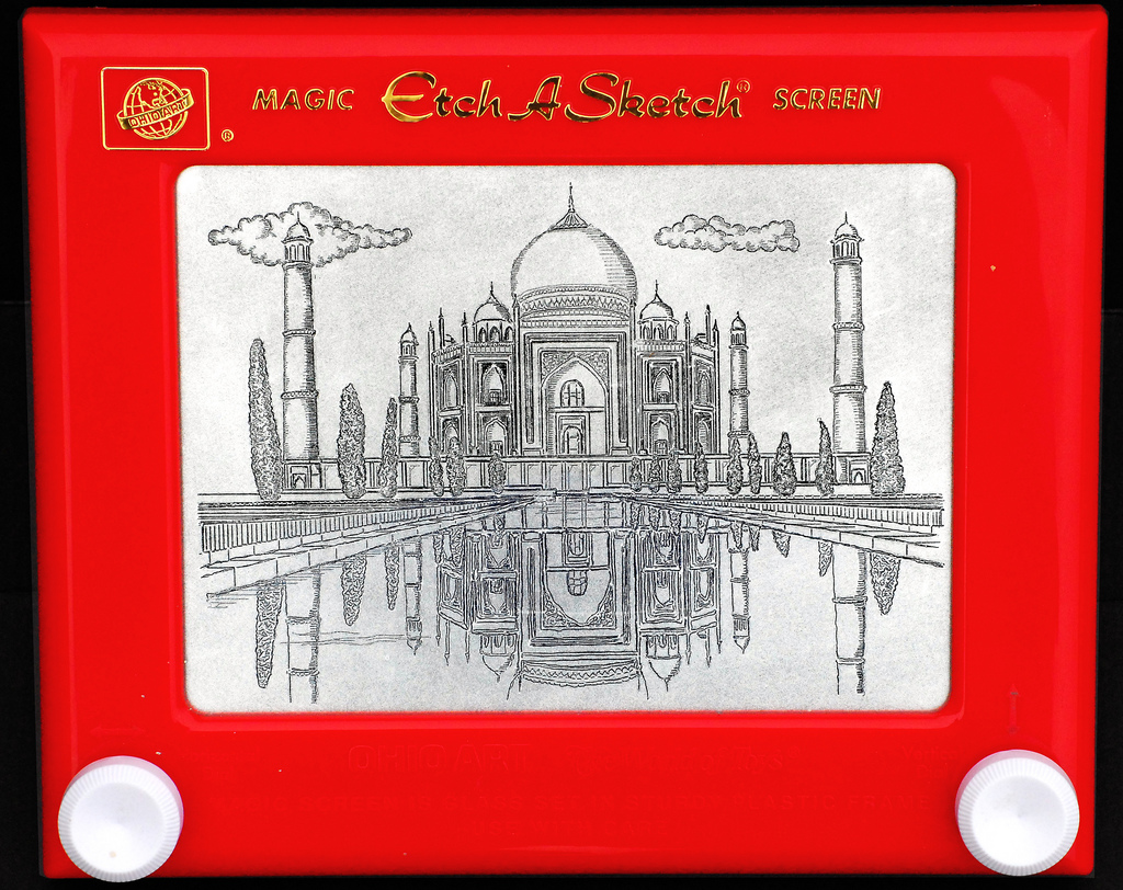 An Etch-a-sketch toy with a picture of the Taj Mahal drawn on it