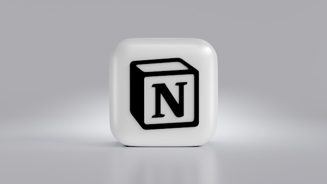 A 3D block the Notion app logo on it.