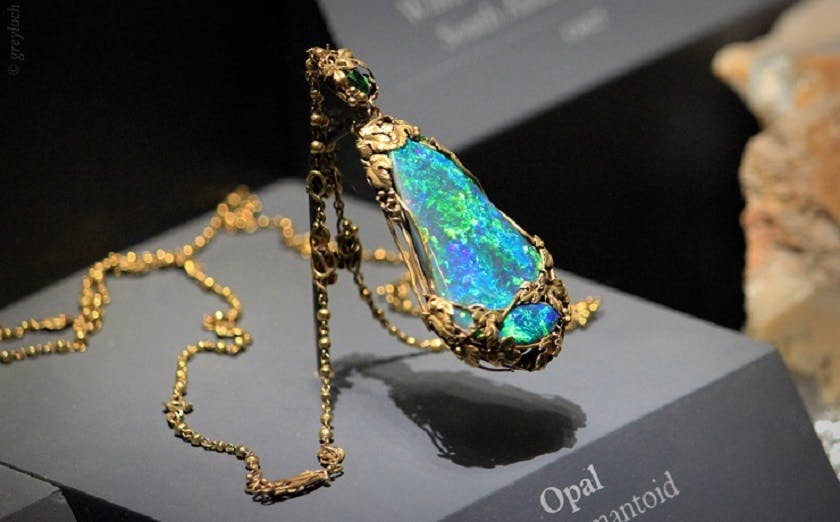 A necklace with a blue and green opal in it.