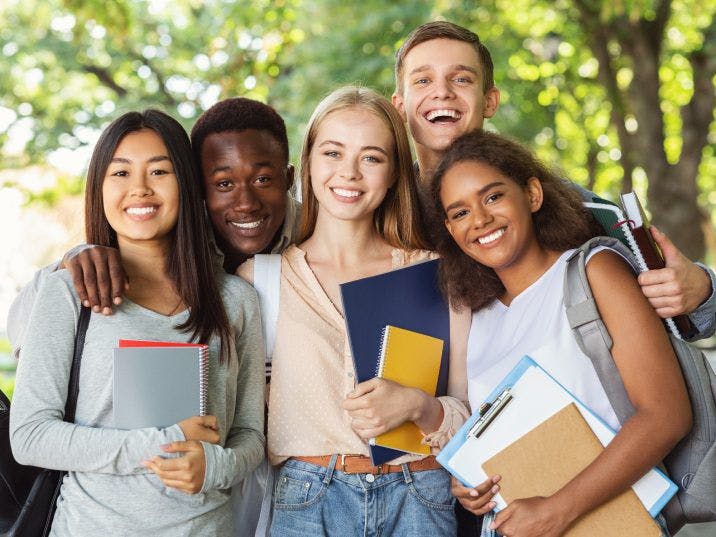 Happy students with their books.