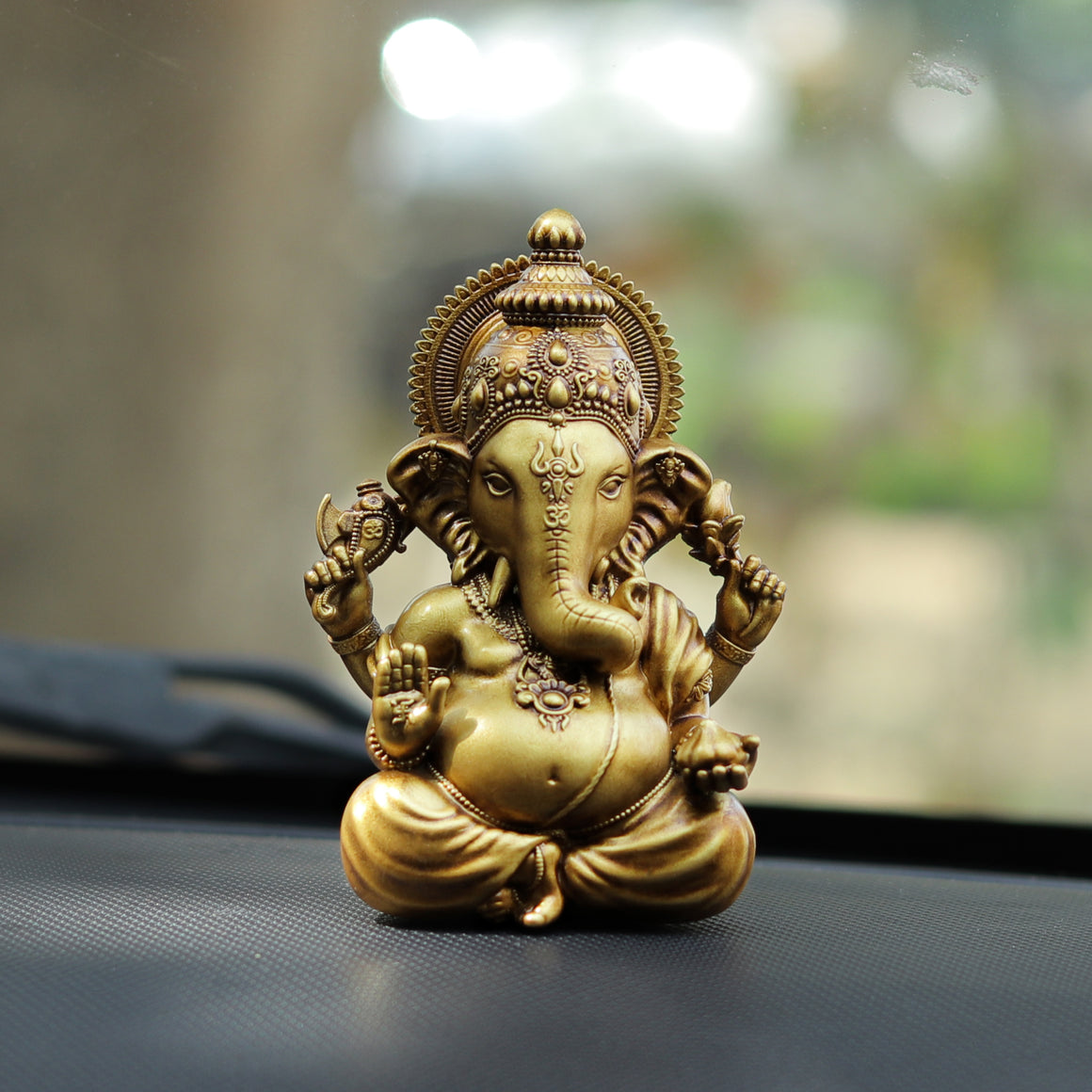 Ganesha Idol for Your Car Dashboard: Bringing Divine Blessings to Your Journey