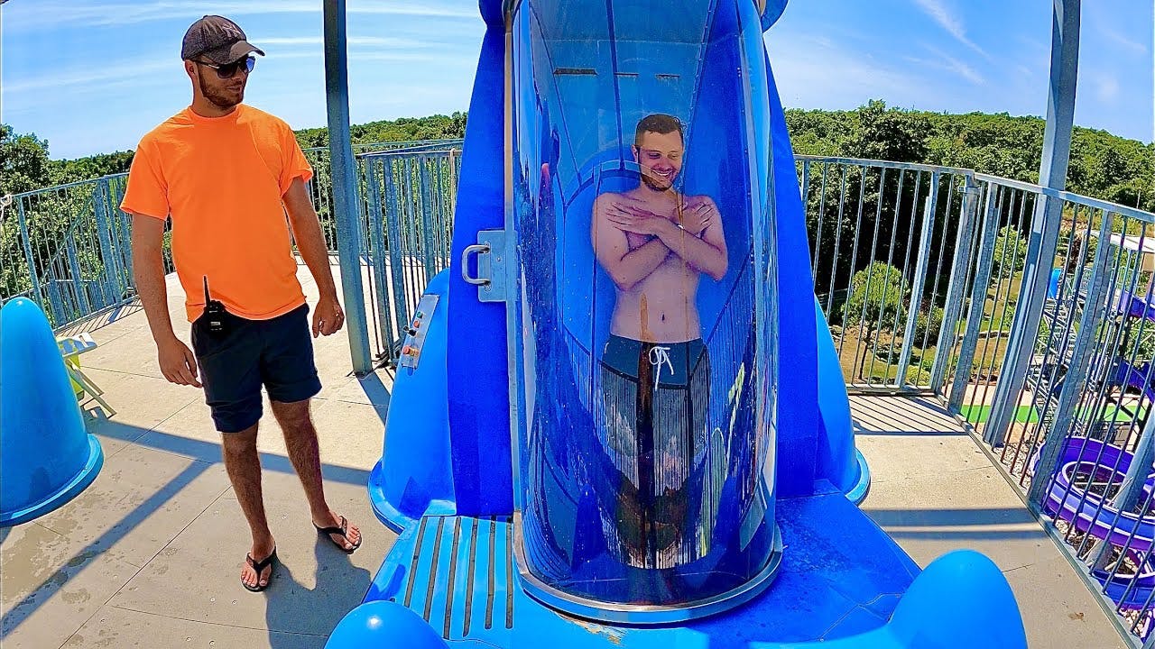 Man about to drop in the Aquadrop as the employee oversees for safety.