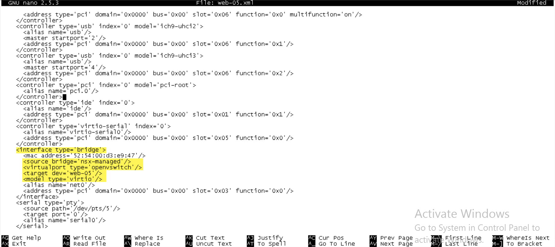 A screenshot of a text editor displaying an XML configuration file with various hardware component settings. The highlighted section shows a network interface configuration with type 'bridge', a specified MAC address, and details of the source bridge and virtual port type.