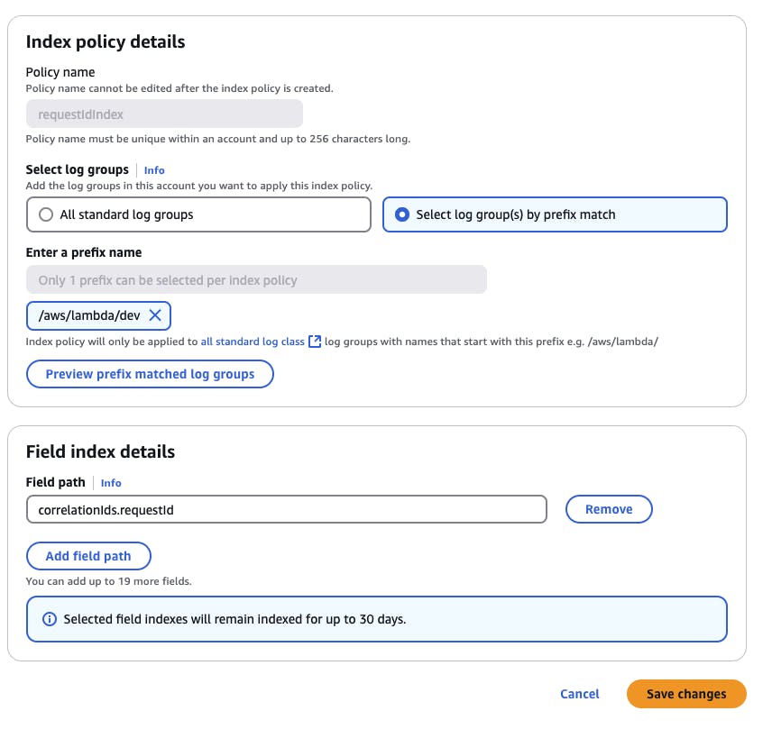 Screenshot of an interface for configuring index policy details. The section includes fields for policy name and log group selection, with options for "All standard log groups" or "Select log group(s) by prefix match." A text box for entering a prefix name is filled with "/aws/lambda/dev." It also shows field index details, with "correlationIds.requestId" as the field path. Options to add or remove field paths are present. Buttons for "Cancel" and "Save changes" are at the bottom.