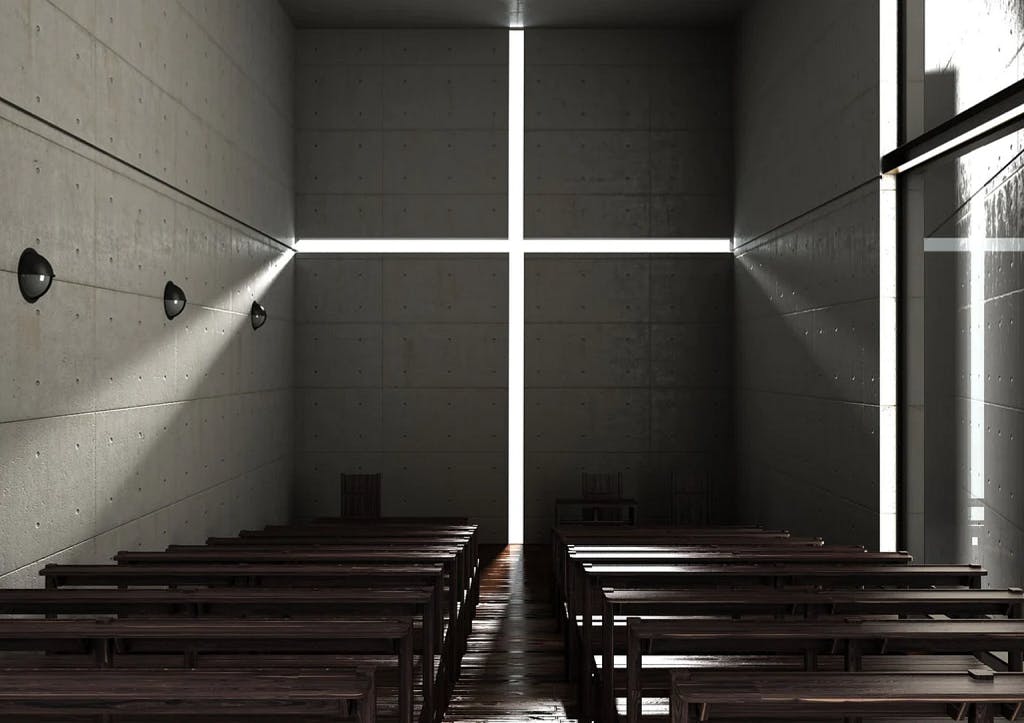 A dark church with dar wooden benches, and on the back wall a cross made of light caused by horizontal and vertical gaps on the wall