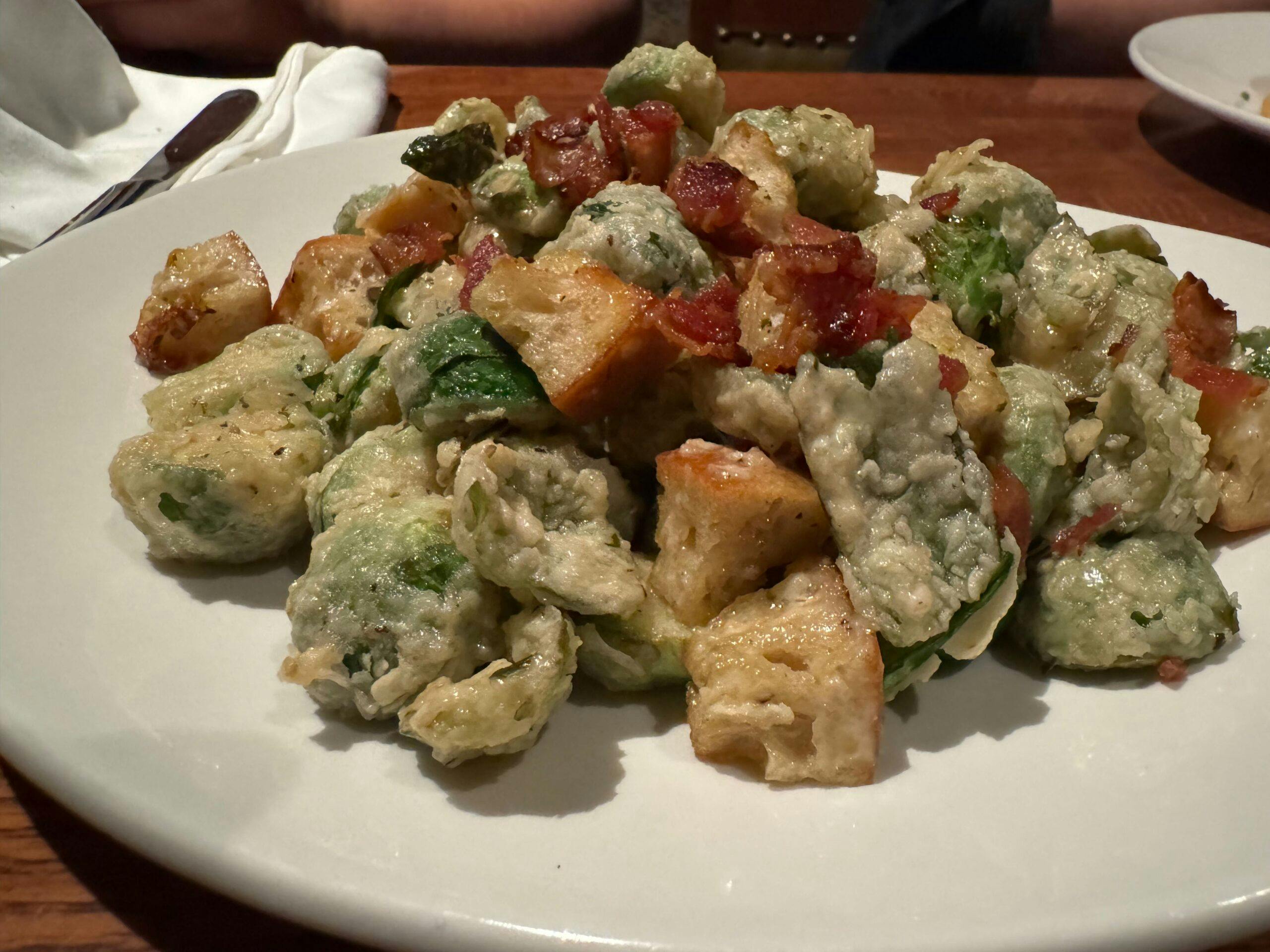 burssel sprouts battered and fried with bacon and bread cubes. 