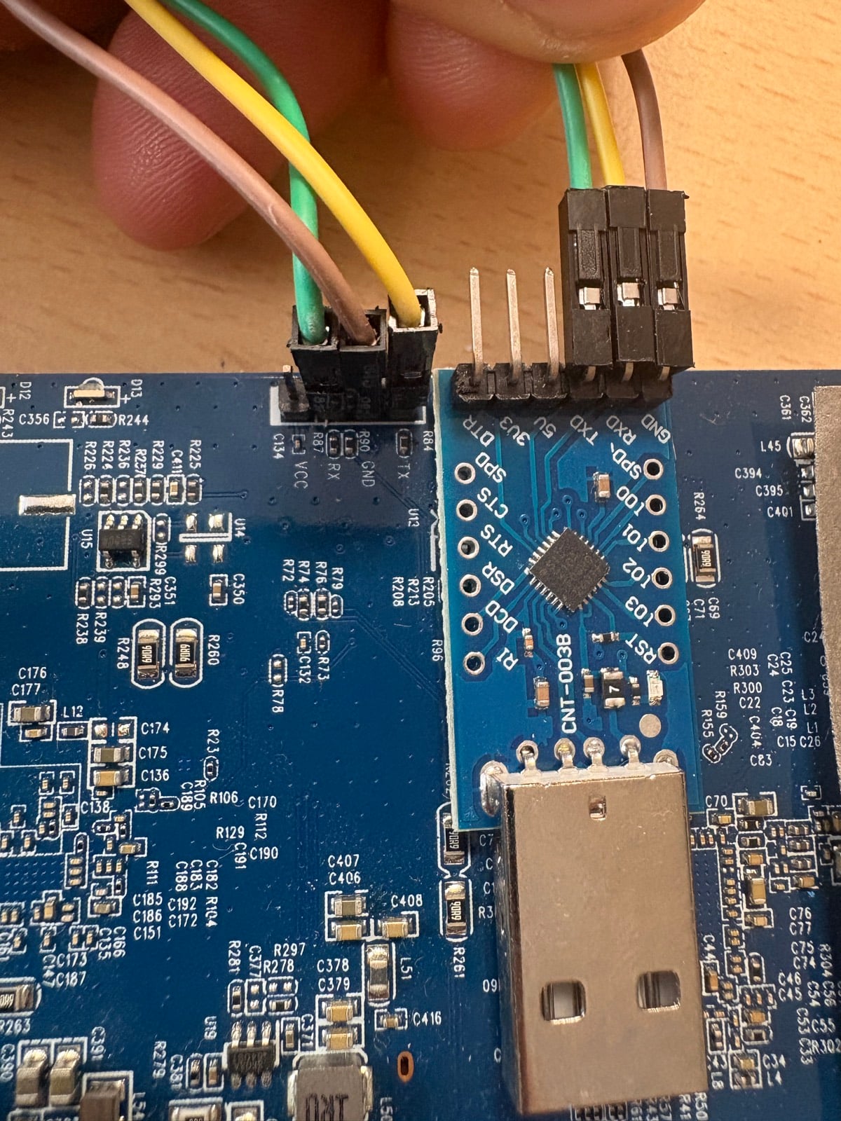 CP2102 USB-UART adapter wired to the OAP1300 TX / GND / RX serial header
