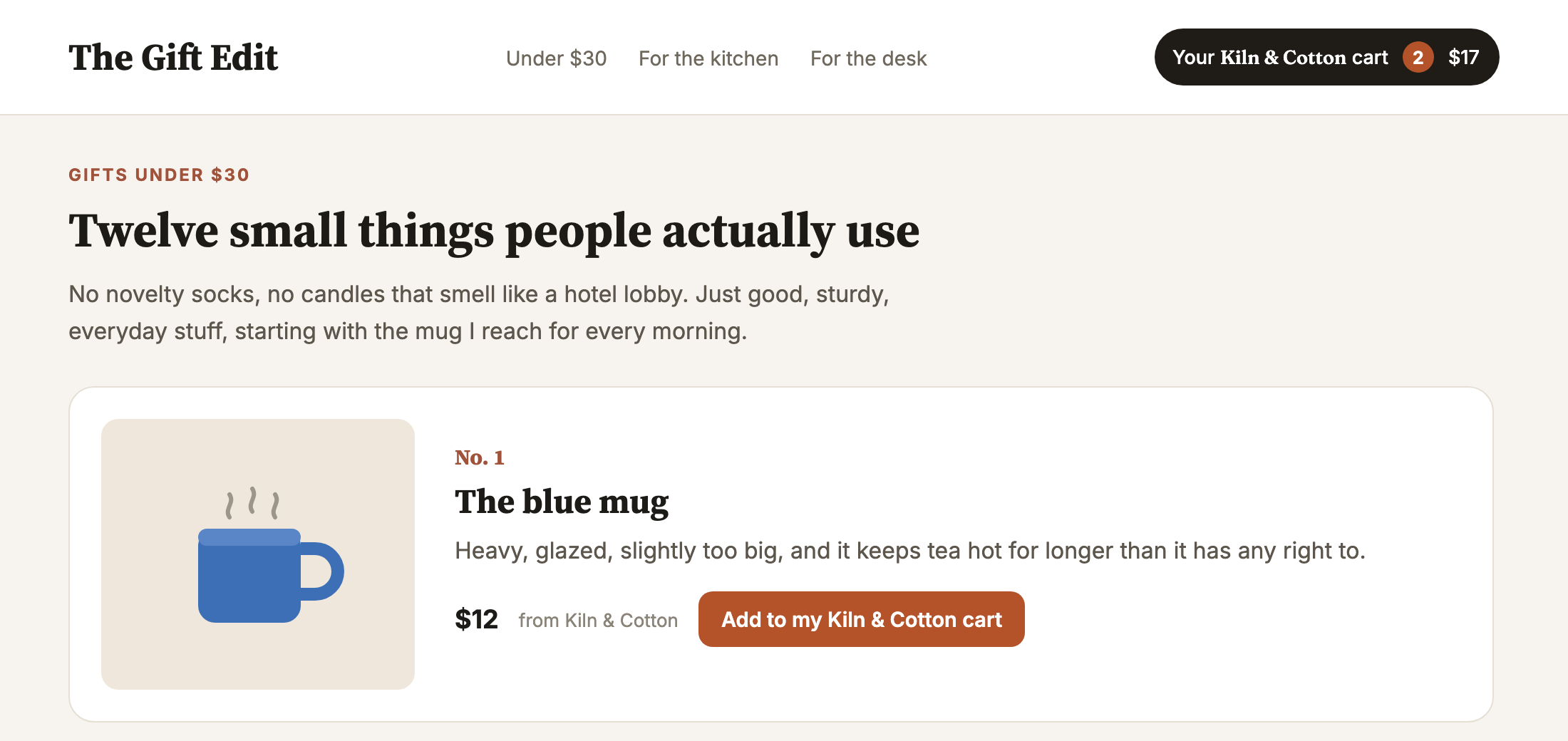 The Gift Edit, a gift guide page. Its pick, the blue mug from Kiln and Cotton, has a button reading Add to my Kiln and Cotton cart, and a pill in the header shows the reader's Kiln and Cotton cart with 2 items, $17.