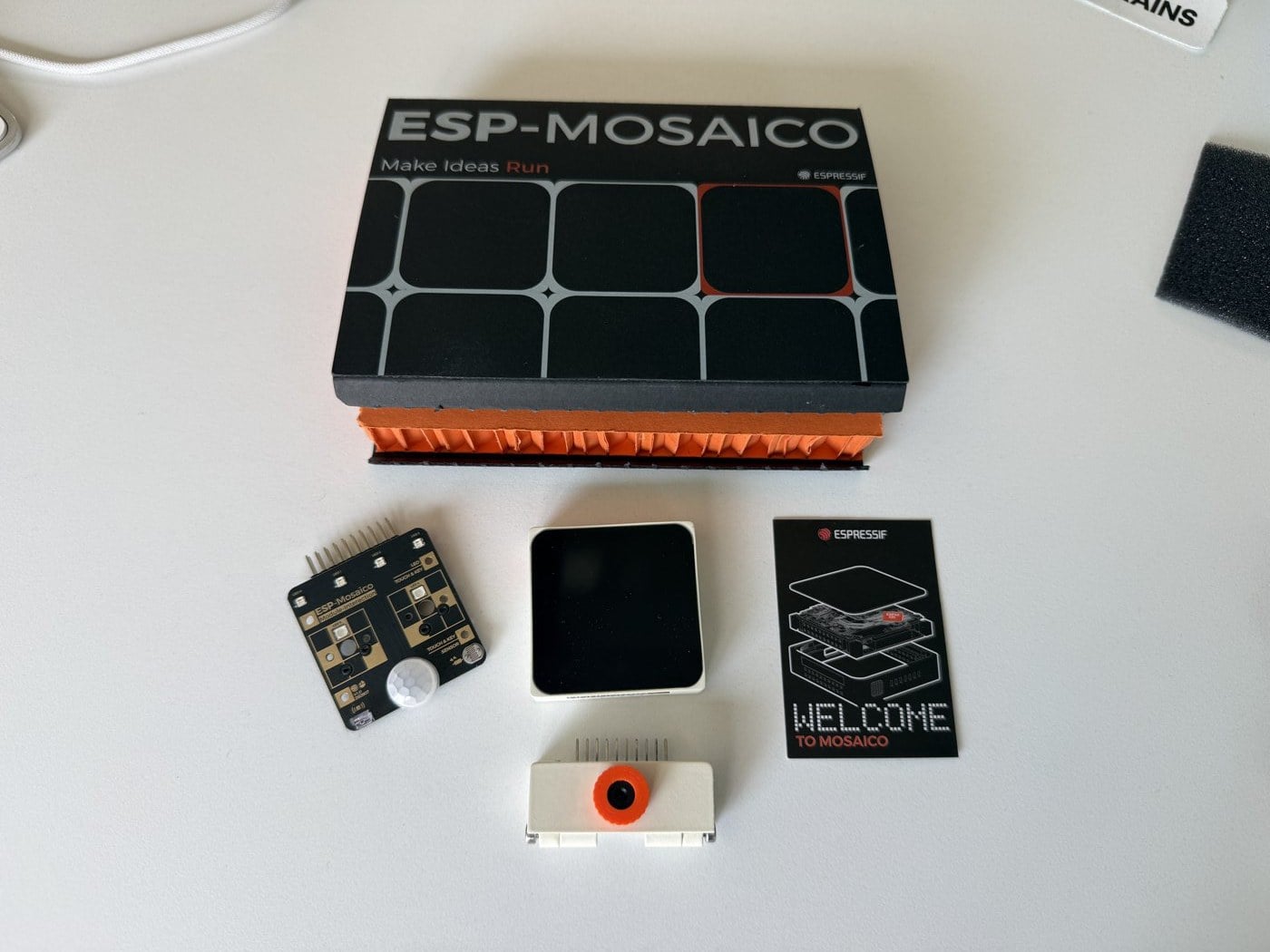 The ESP-Mosaico box with the CoreBoard, camera module, and Interaction module